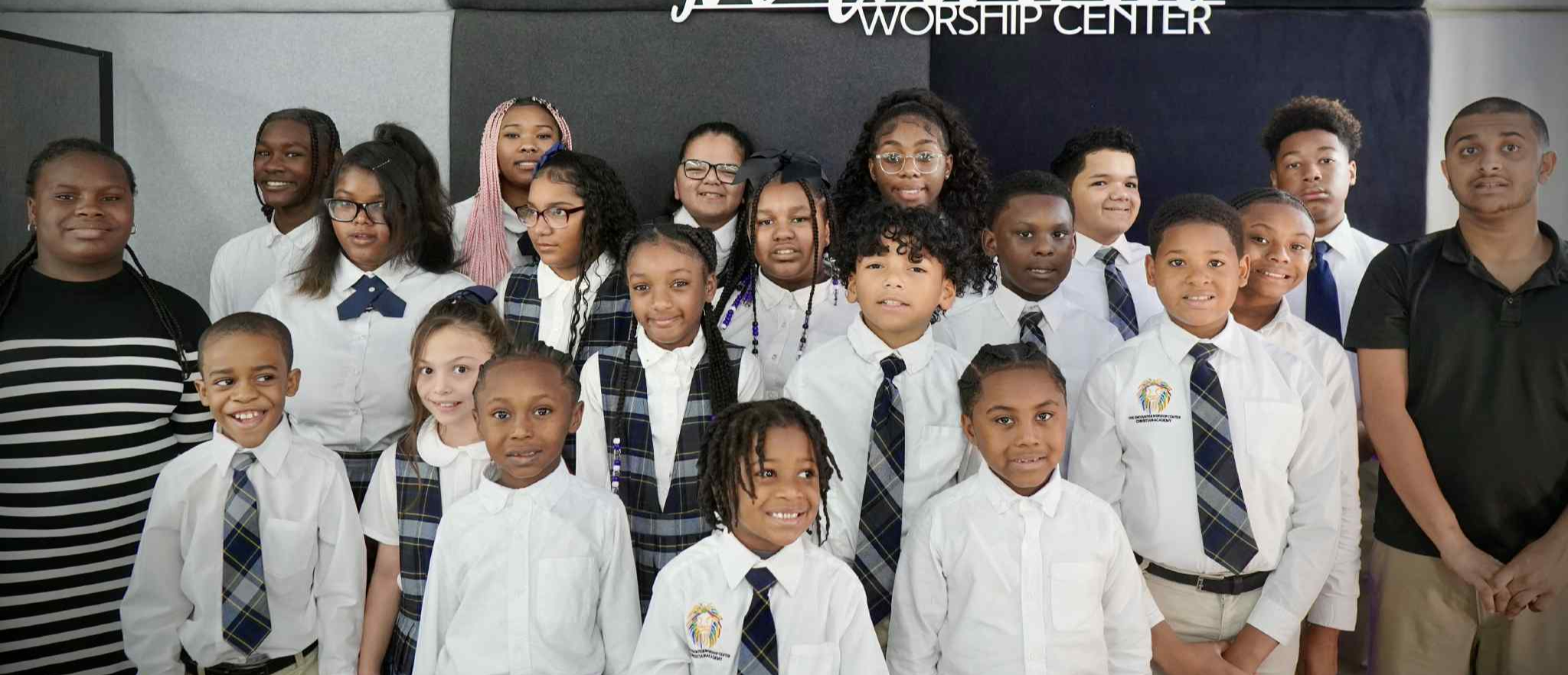 The EWCCA school community gathered for a group photograph